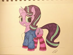 Size: 1040x780 | Tagged: safe, artist:taurson, starlight glimmer, pony, unicorn, clothes, female, grin, hoodie, looking at you, mare, nervous, nervous grin, smiling, socks, solo, starlight glimmer day, striped socks, traditional art