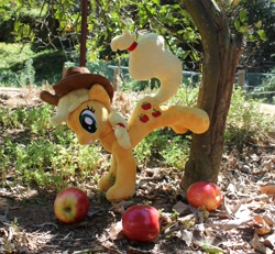 Size: 3531x3258 | Tagged: safe, artist:sirdragonlance, applejack, apple, applebucking, applejack mid tree-buck facing the left with 3 apples falling down, applejack mid tree-buck with 3 apples falling down, falling, food, irl, photo, plushie, solo