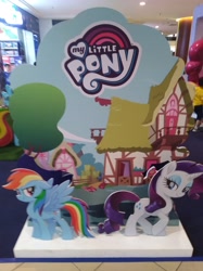 Size: 3016x4032 | Tagged: safe, derpibooru import, photographer:horsesplease, rainbow dash, rarity, pegasus, pony, unicorn, my little pony: the movie, malaysia, my little pony logo