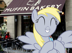 Size: 1372x1016 | Tagged: safe, derpy hooves, pegasus, pony, bakery, irl, muffin, photo, ponies in real life, smiling, that pony sure does love muffins