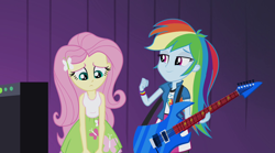 Size: 1280x714 | Tagged: safe, derpibooru import, screencap, fluttershy, rainbow dash, equestria girls, rainbow rocks, amplifier, barrette, fist pump, guitar, sad