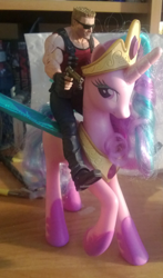 Size: 832x1412 | Tagged: safe, princess celestia, desk, doll, duke nukem, gun, irl, photo, pinklestia, riding, toy, toy pony cavalry