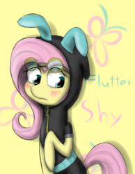 Size: 700x900 | Tagged: safe, artist:sticky-plaster, fluttershy, pegasus, pony, blushing, bunny ears, clothes, costume, cute, cutie mark background, dangerous mission outfit, female, goggles, hoodie, mare, simple background, solo, yellow background