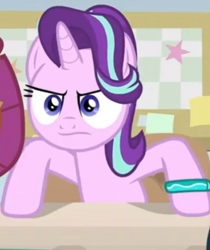 Size: 558x665 | Tagged: safe, screencap, smolder, starlight glimmer, alicorn, dragon, pony, student counsel, angry, bracelet, cropped, dragoness, female, frown, hooves on the table, jewelry, mare, offscreen character, solo focus, starlight is not amused, starlight's bracelet, unamused