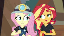 Size: 1280x720 | Tagged: safe, screencap, fluttershy, sunset shimmer, equestria girls, equestria girls series, opening night, opening night: sunset shimmer, headlamp, helmet, miner, mining helmet