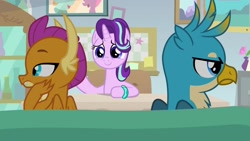 Size: 1920x1080 | Tagged: safe, screencap, gallus, smolder, starlight glimmer, dragon, griffon, pony, unicorn, student counsel, angry, annoyed, bickering, bracelet, claws, desk, dragoness, duo, facing away, female, folded wings, frown, gallus is not amused, guidance counselor, hand on cheek, indifferent, jewelry, lidded eyes, male, mare, scowl, sofa, starlight's office, trio, unamused, wings
