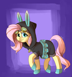 Size: 1200x1300 | Tagged: safe, artist:passigcamel, fluttershy, pegasus, pony, belt, bunny ears, clothes, costume, dangerous mission outfit, female, goggles, hoodie, looking at you, mare, raised hoof, smiling, solo, utility belt