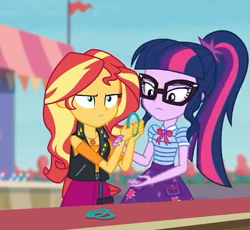 Size: 587x540 | Tagged: safe, screencap, sci-twi, sunset shimmer, twilight sparkle, better together, equestria girls, rollercoaster of friendship, clothes, cropped, female, geode of empathy, geode of telekinesis, glasses, jacket, leather jacket, ponytail, shirt, skirt