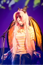 Size: 683x1024 | Tagged: artist needed, safe, fluttershy, human, 2014, collar, cosplay, flutterbat, irl, irl human, microphone, photo, rubronycon, solo, stage