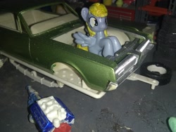 Size: 3264x2448 | Tagged: safe, derpy hooves, blind bag, car, engine, everfree customs, garage, irl, mercury (car), mercury cougar, photo, solo, tires, toolbox, toy, trailer