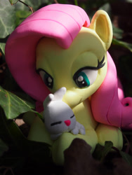 Size: 3024x4032 | Tagged: safe, artist:dustysculptures, angel bunny, fluttershy, bedroom eyes, craft, cuddling, cute, hug, irl, photo, prone, sculpture, shyabetes, sleeping, smiling, snuggling, toy
