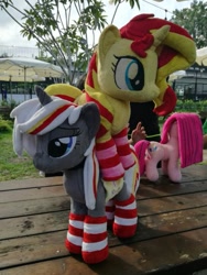 Size: 507x676 | Tagged: safe, artist:epicrainbowcrafts, pinkie pie, sunset shimmer, oc, oc:velvet remedy, earth pony, pony, unicorn, fallout equestria, clothes, cute, cutie mark, fanfic, fanfic art, female, fluttershy medical saddlebag, grass, hooves, horn, irl, mare, medical saddlebag, photo, pinkamena diane pie, saddle bag, socks, striped socks, table