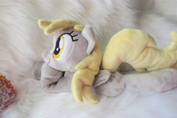 Size: 5472x3648 | Tagged: safe, artist:kazzysart, derpy hooves, pegasus, pony, beanie (plushie), female, folded wings, irl, mare, photo, plushie, prone, solo, wings