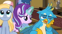 Size: 1600x896 | Tagged: safe, screencap, blues, dark moon, fuchsia frost, gallus, goldy wings, graphite, noteworthy, starlight glimmer, griffon, unicorn, a horse shoe-in, beak, bored, claws, confused, displeased, female, folded wings, friendship student, frown, gallus is not amused, glowing horn, guidance counselor, hand on cheek, horn, levitation, magic, magic aura, male, mare, pencil, raised eyebrow, smiling, spread wings, talons, teenager, telekinesis, unamused, wings