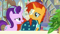 Size: 1920x1080 | Tagged: safe, screencap, phyllis, starlight glimmer, sunburst, pony, unicorn, a horse shoe-in, beard, bookshelf, childhood friends, clothes, duo, facial hair, female, glasses, globe, lidded eyes, looking at each other, male, mare, open mouth, philodendron, proud, robe, smiling, stallion, sunburst's glasses, sunburst's robe, talking, trixie's office