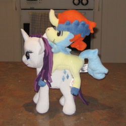 Size: 1594x1594 | Tagged: safe, artist:cheerbearsfan, rarity, pony, interspecies, irl, keldeo, keldity, photo, plushie, pokémon, pokémon riding ponies, pony on pokémon action, riding