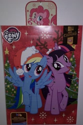 Size: 1835x2770 | Tagged: safe, derpibooru import, pinkie pie, rainbow dash, twilight sparkle, twilight sparkle (alicorn), alicorn, earth pony, pegasus, pony, advent calendar, candy, candy cane, christmas, christmas lights, christmas tree, finland, food, hat, holiday, my little pony logo, santa hat, tree