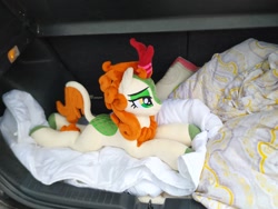 Size: 2048x1536 | Tagged: safe, artist:burgunzik, autumn blaze, kirin, sounds of silence, bedsheets, cloven hooves, female, irl, lidded eyes, photo, plushie, prone, smiling, solo