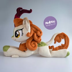 Size: 1600x1600 | Tagged: safe, alternate version, artist:meplushyou, autumn blaze, kirin, sounds of silence, cloven hooves, female, irl, photo, plushie, prone, smiling, solo, watermark