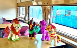 Size: 2082x1314 | Tagged: safe, artist:hihin1993, autumn blaze, berry punch, berryshine, cinder glow, summer flare, sunset shimmer, kirin, irl, japan, photo, plushie, train