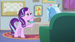 Size: 1920x1080 | Tagged: safe, screencap, starlight glimmer, pony, unicorn, student counsel, bracelet, female, floppy ears, jewelry, mare, open mouth, raised hoof, sofa, solo, starlight's office