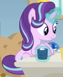Size: 344x421 | Tagged: safe, screencap, starlight glimmer, pony, unicorn, marks for effort, chocolate, cropped, desk, empathy cocoa, food, glow, glowing cup, glowing horn, hooves on the table, horn, hot chocolate, looking at someone, marshmallows, sitting, solo, starlight's office