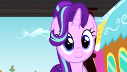 Size: 1312x738 | Tagged: safe, screencap, starlight glimmer, pony, unicorn, all bottled up, cute, female, glimmerbetes, looking at you, mare, ponyville, smiling, solo, train, train station