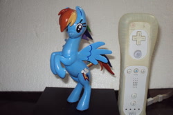 Size: 600x400 | Tagged: safe, artist:succubi samus, derpibooru import, rainbow dash, pony, bipedal, clay figure, irl, looking at you, nintendo, photo, sculpture, wii remote