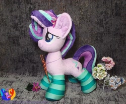 Size: 1280x1053 | Tagged: safe, artist:1stastrastudio, starlight glimmer, pony, unicorn, clothes, flower, irl, jewelry, pendant, photo, plushie, smiling, socks, solo, staff, staff of sameness, striped socks