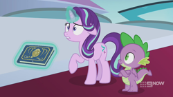 Size: 1280x720 | Tagged: safe, screencap, spike, starlight glimmer, dragon, pony, unicorn, memories and more, spoiler:memories and more, spoiler:mlp friendship is forever, 9now, book, crossed arms, duo, levitation, magic, magic aura, scrapbook, shrunken pupils, telekinesis, winged spike, worried