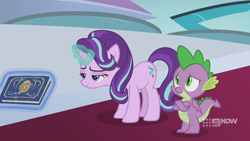 Size: 1280x720 | Tagged: safe, screencap, spike, starlight glimmer, dragon, pony, unicorn, memories and more, spoiler:memories and more, spoiler:mlp friendship is forever, 9now, book, crossed arms, duo, levitation, magic, magic aura, mid-blink screencap, scrapbook, telekinesis, winged spike