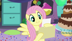 Size: 1280x720 | Tagged: safe, screencap, fluttershy, pegasus, pony, party pooped, cake, cute, file, folder, food, grin, hoof hold, paper, reading, solo, spread wings