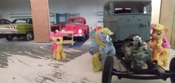 Size: 3264x1546 | Tagged: safe, apple bloom, applejack, derpy hooves, pinkie pie, rainbow dash, earth pony, pegasus, pony, blind bag, cart, chevrolet impala, engine, everfree customs, garage, toy, volkswagen beetle