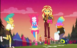 Size: 1169x720 | Tagged: safe, screencap, pinkie pie, snails, snips, sunset shimmer, cat, equestria girls, equestria girls series, sunset's backstage pass!, spoiler:eqg series (season 2), basket, boots, clothes, converse, crying, eyes closed, female, hair bun, hat, hattie, jacket, legs, male, music festival outfit, pants, pantyhose, shoes, shorts, skirt, sky, sneakers, socks
