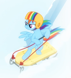 Size: 578x627 | Tagged: safe, derpibooru import, screencap, rainbow dash, pegasus, pony, tanks for the memories, bipedal, cropped, female, helmet, mare, sled, sledding, solo, spread wings, wings