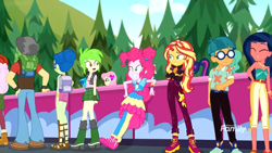 Size: 1280x720 | Tagged: safe, screencap, cherry crash, desert sage, dj pon-3, fluttershy, garden grove, laurel jade, pinkie pie, raspberry lilac, sandalwood, sci-twi, sunset shimmer, twilight sparkle, vinyl scratch, better together, equestria girls, sunset's backstage pass!, background human, backpack, bare shoulders, clothes, crossed arms, doodle bug, geode of sugar bombs, geode of telekinesis, glasses, magical geodes, pants, pantyhose, rear view, sandals, sleeveless, smiling, strapless