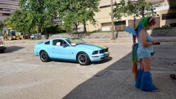 Size: 1280x720 | Tagged: dead source, safe, derpibooru import, rainbow dash, human, bronycon, bronycon 2019, car, clothes, cosplay, costume, ford, ford mustang, irl, irl human, photo