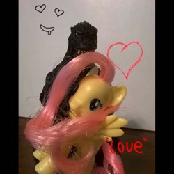 Size: 600x600 | Tagged: safe, fluttershy, kaiju, pegasus, pony, brushable, godzilla, godzilla (series), hug, neca, toy