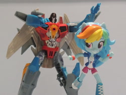 Size: 1024x768 | Tagged: safe, artist:lonetrekker, derpibooru import, rainbow dash, equestria girls, action figure, clash of hasbro's titans, crossover, doll, equestria girls minis, eqventures of the minis, starscream, starscream vs rainbow dash, toy, transformers, transformers robots in disguise (2015)