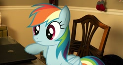 Size: 764x402 | Tagged: artist needed, source needed, safe, derpibooru import, rainbow dash, pony, chair, computer, irl, laptop computer, photo, ponies in real life, solo, table