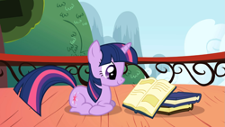 Size: 1365x768 | Tagged: safe, derpibooru import, screencap, twilight sparkle, unicorn twilight, pony, unicorn, applebuck season, book, cute, female, mare, ponyloaf, prone, reading, smiling, solo, twiabetes