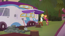 Size: 1280x720 | Tagged: safe, screencap, applejack, sunset shimmer, bird, better together, equestria girls, wake up!, wake up!: applejack, clothes, forest, pajamas, rock, rv, shovel, tree stump