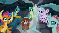 Size: 1280x720 | Tagged: safe, screencap, gallus, ocellus, sandbar, silverstream, smolder, yona, changedling, changeling, classical hippogriff, dragon, earth pony, griffon, hippogriff, pony, yak, what lies beneath, bow, cloven hooves, dragoness, female, flying, hair bow, jewelry, male, monkey swings, necklace, raised eyebrow, student six, teenager