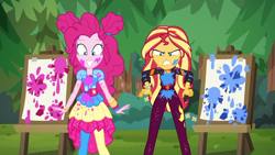 Size: 1920x1080 | Tagged: safe, screencap, pinkie pie, sunset shimmer, better together, equestria girls, sunset's backstage pass!, angry, clothes, cute, diapinkes, duo, duo female, easel, female, geode of empathy, geode of sugar bombs, happy, magical geodes, messy, music festival outfit, outdoors, paint, pantyhose, smiling, sunset shimmer is not amused, unamused, varying degrees of amusement