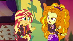 Size: 1920x1080 | Tagged: safe, screencap, adagio dazzle, sunset shimmer, better together, equestria girls, sunset's backstage pass!, bracelet, clothes, geode of empathy, jacket, jewelry, leather jacket, magical geodes, music festival outfit, shorts, spiked wristband, wristband