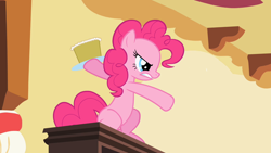 Size: 1280x720 | Tagged: safe, screencap, pinkie pie, earth pony, pony, secret of my excess, angry, assaulting with cake, cake, food, gritted teeth, growling, sitting, solo, throwing