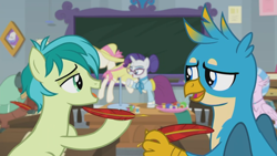 Size: 1920x1080 | Tagged: safe, screencap, gallus, rarity, sandbar, silverstream, yona, classical hippogriff, earth pony, griffon, hippogriff, pony, unicorn, school daze, alternate hairstyle, birthday dress, classroom, clothes, dress, duo focus, glasses, hair bun, hat, jewelry, necklace, quill pen, schoolmarm rarity