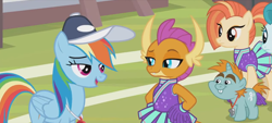 Size: 1298x588 | Tagged: safe, derpibooru import, screencap, rainbow dash, smolder, snips, dragon, pegasus, pony, unicorn, 2 4 6 greaaat, bucktooth, cheerleader, cheerleader outfit, cheerleader smolder, clothes, coach rainbow dash, coaching cap, colt, dragoness, eyeshadow, fangs, female, foal, folded wings, frown, hands on hip, horns, lidded eyes, makeup, male, mare, multicolored mane, multicolored tail, pom pom, ponytail, raised eyebrow, smiling, smirk, talking, teacher and student, teenaged dragon, teenager, whistle necklace