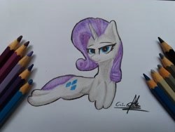 Size: 4128x3096 | Tagged: safe, artist:ironbeastz, rarity, pony, unicorn, pencil, prone, solo, traditional art