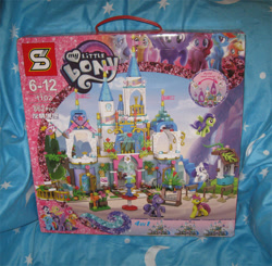 Size: 713x700 | Tagged: safe, artist:heckyeahponyscans, derpibooru import, applejack, fluttershy, pinkie pie, rainbow dash, rarity, spike, twilight sparkle, twilight sparkle (alicorn), alicorn, pegasus, pony, unicorn, bootleg, bootleg lego, box, irl, my little lony, photo, toy